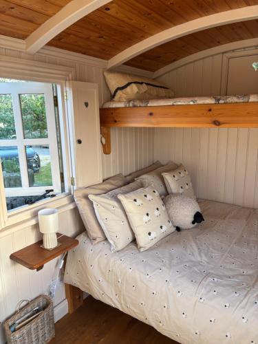 a bed in a small room with a bunk bed at Shepherds Rest in Peak Forest