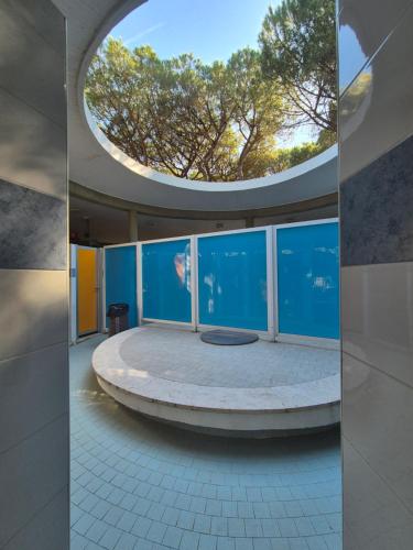 a circular room with a round table in a building at Bella Tents - Camping Vibes in Marina di Grosseto