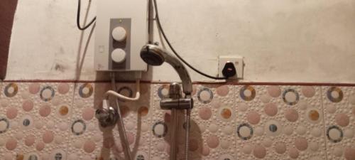 a bathroom with a electrical outlet on the wall at Gotrika Valley Gesst in Ella
