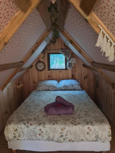 a bedroom with a bed in a attic at Nuit insolite et féerique tout près d'Ajaccio in Alata