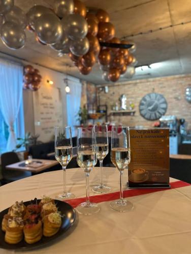 a group of wine glasses sitting on a table at Apartmány u Bašty in Hlučín
