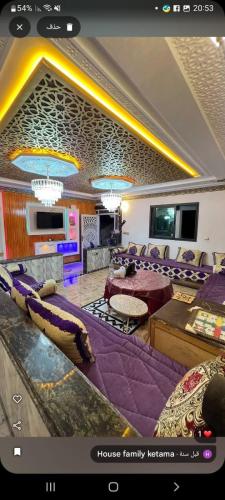 a picture of a living room with purple furniture at Maison hôte ketama in Tlata Ketama