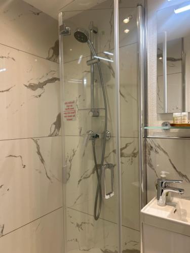 a bathroom with a shower and a sink at Burghotel Homberg in Homberg