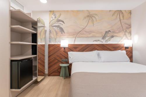 Llit o llits en una habitació de Hotel Welcome Teruel