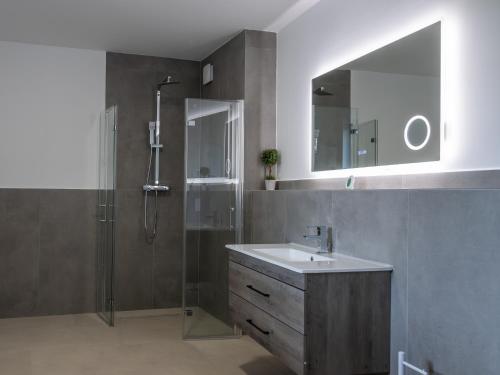 a bathroom with a sink and a shower at Ferienwelt Wittenberge in Wittenberge