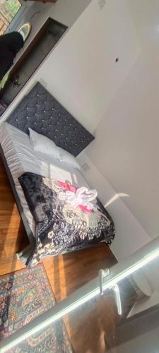 a bed in a room with a glass table at Varattumedu Hill in Vagamon