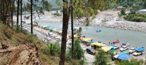 a view of a river with a bunch of boats at Nothing in Kulu