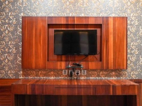 a flat screen tv attached to a wall at Donyi Polo International in Itānagar