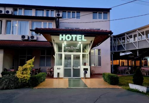 a hotel with a sign on the front of it at Hotel Slodes in Belgrade