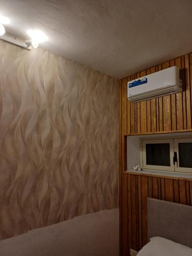 a room with a wall with a wood pattern at Villa Margherita in Maratea