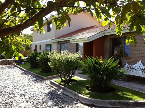 a house with plants in front of it at La Casita de Fraida in Guadalajara