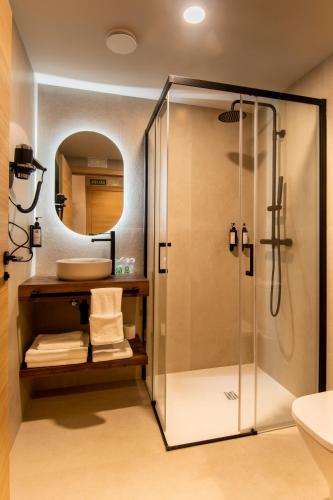 a bathroom with a shower and a sink at Hotel Casa Juan in Ayegui