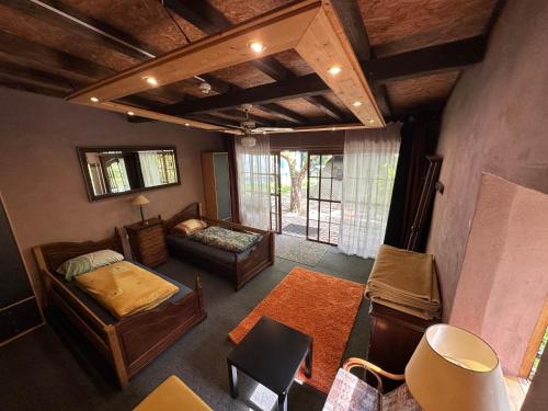 an overhead view of a room with a bed and a couch at Sandino Summer Camp in Berlin