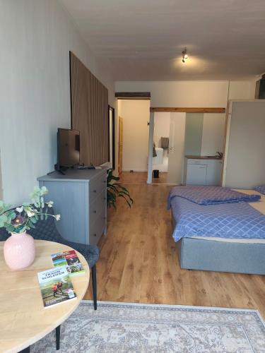 a room with two beds and a coffee table in it at Apartment Linde Otzenhausen in Nonnweiler