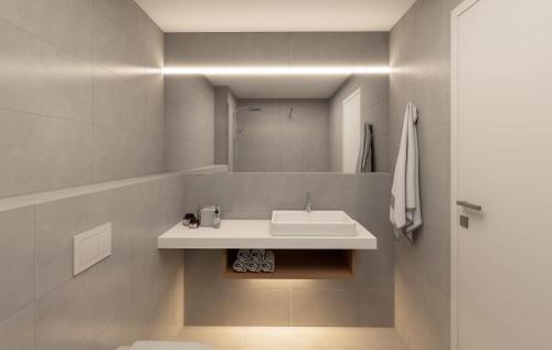 a bathroom with a sink and a mirror at Hotel a vinařství Lacina in Velké Pavlovice