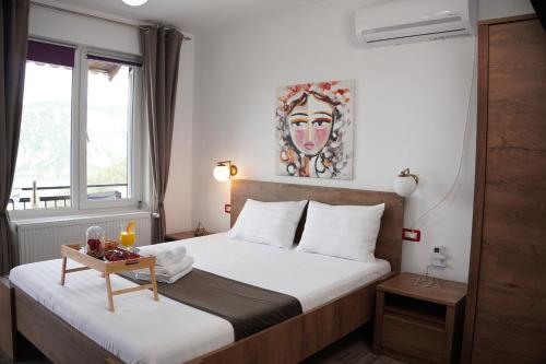 a hotel room with a bed and a table at Casa Corina Dubova in Dubova