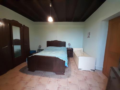 a bedroom with a large bed in a room at Maison lacabane in Saint-Sever