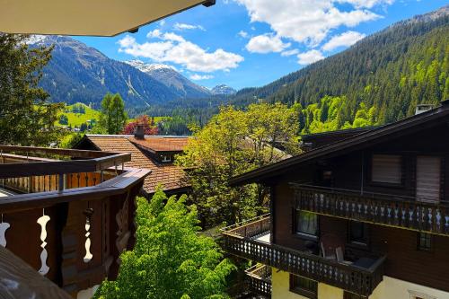 a view from the balcony of a house in the mountains at Panorama Apartment Gotschnablick 1-6 Pers in Klosters