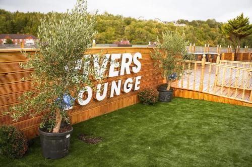 a wooden fence with a sign that reads viewers journey at Rivers Hotel in Newcastle upon Tyne
