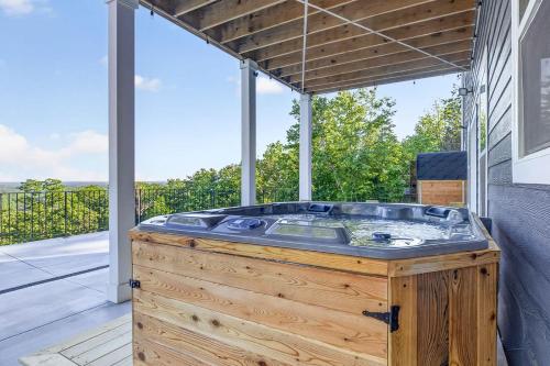 a hot tub sitting on top of a wooden deck at Mountain View Escape in Taylors