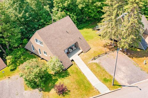 an overhead view of a house with a roof at Pool & Spa - Chalet Le Misco in Beaupré