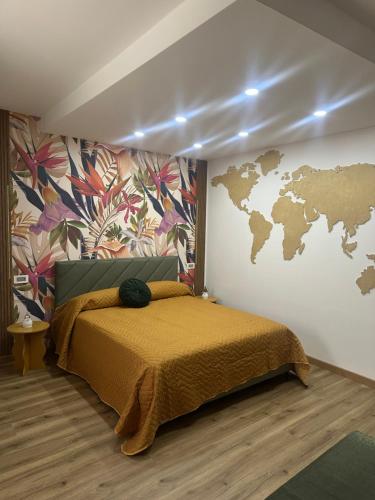 a bedroom with a bed with a map on the wall at Aer in Caserta