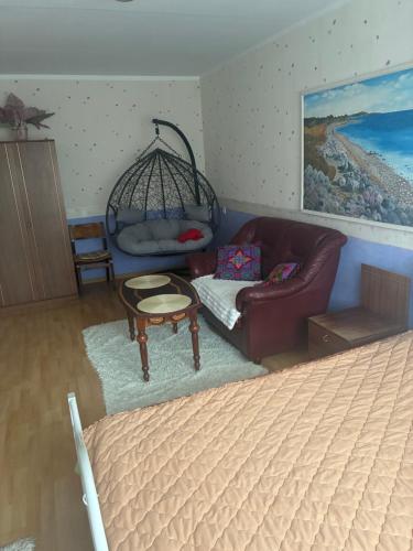 a living room with a bed and a couch at Kohtla -Järve, Iidla in Kohtla-Järve