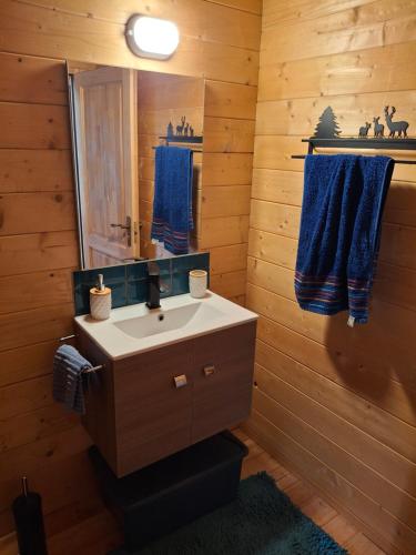 a bathroom with a sink and a mirror at The Sam's house in Panouryiás