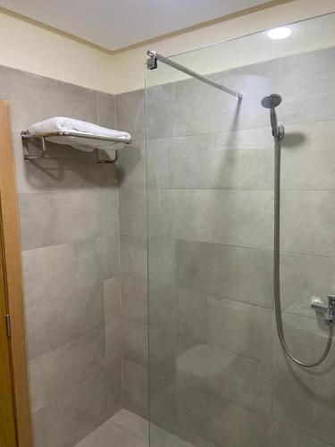 a bathroom with a shower with a glass door at Rabat Easy Access ll in Rabat