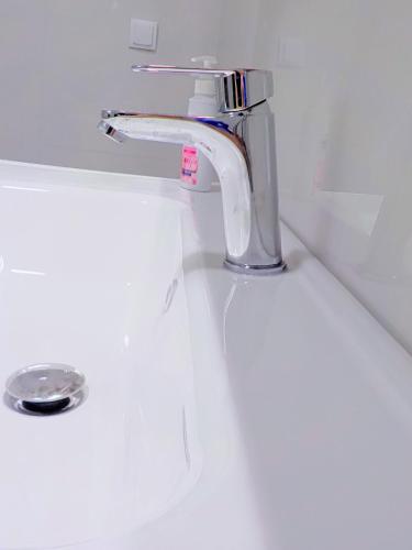 a sink with a faucet in a bathroom at GAIA City Studio in Kato Achaia