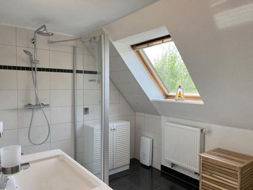 a bathroom with a shower and a bath tub at Haus-Min-Leevstes in Böhl