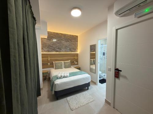 a bedroom with a bed and a window at Hotel Boutique Traveler 360 in Madrid