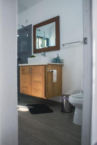 a bathroom with a sink and a mirror at Villa La Dueña Perfect Escape in Las Terrenas