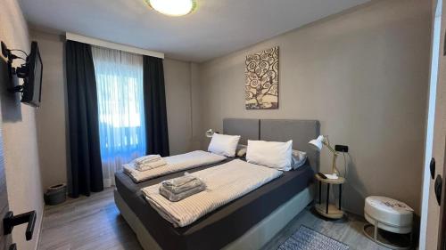 a bedroom with a bed in a room with a window at Casa Marika in Valdisotto