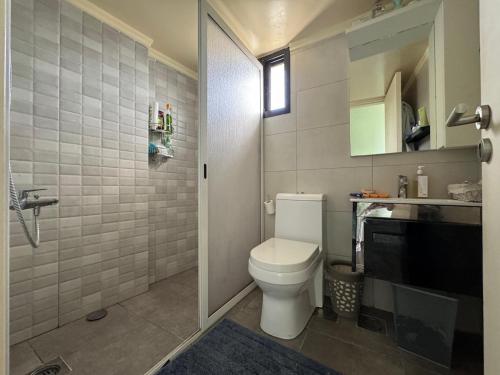 a bathroom with a toilet and a sink at Batroun Escape, 2BR, 24-7 elect, beach view! in Batroûn