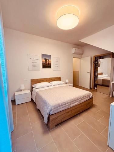 a bedroom with a large bed in a room at Linea d Orizzonte in Francavilla al Mare