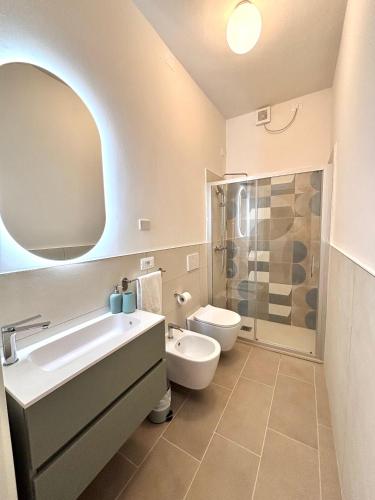 a bathroom with a sink and a toilet and a shower at Linea d Orizzonte in Francavilla al Mare