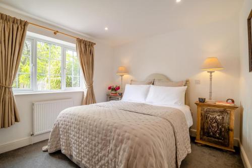 a bedroom with a bed and a window at 1 Bed in Taunton oc-75135 in Isle Brewers