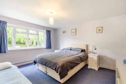 a bedroom with a bed and a window at 4 Bed in Ilkley oc-ds168 in Ilkley