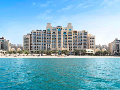 a view of a resort from the water at Fairmont The Palm in Dubai
