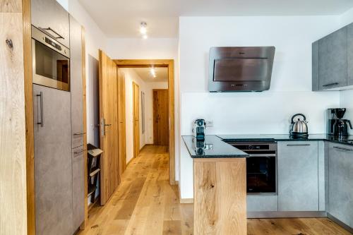 Kuchyň nebo kuchyňský kout v ubytování Alpin Residenzen Panoramabahn by Alpina-Holiday