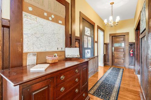 a hallway with a desk with a map on the wall at Prospect Hill on Main in Waynesville
