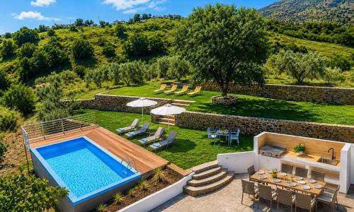 an aerial view of a villa with a swimming pool at Georgioupolis Blue Villa in Georgioupolis