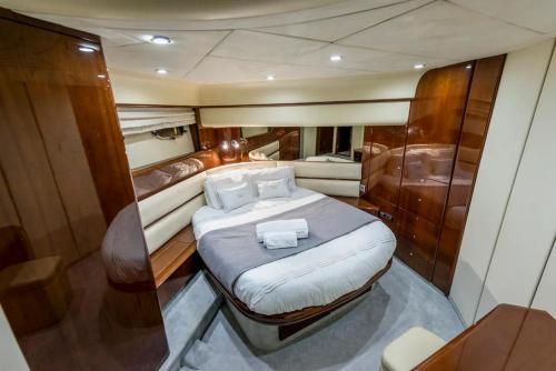 a bed in the middle of a boat at Only One Yacht Cape Town in Cape Town