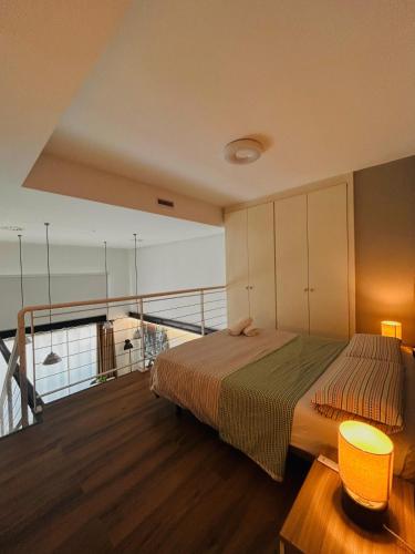 a bedroom with a bed on a balcony at CriteriaHome! nice&easy in Madrid