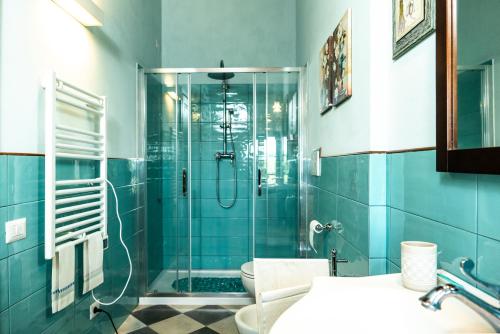 a bathroom with a glass shower with a toilet at La casa di Mariasole in SantʼElpidio a Mare