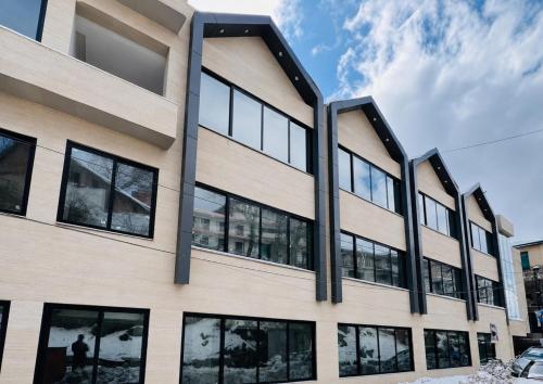 an office building with large windows at Seven Sky Hotel in Murree