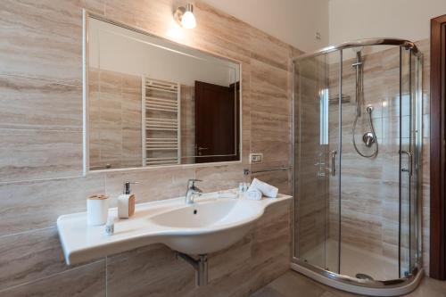 a bathroom with a sink and a shower at La Rocca di PA in Tropea