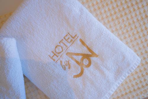 a white tshirt with the word love on it at Hotel by Jon in Dhërmi