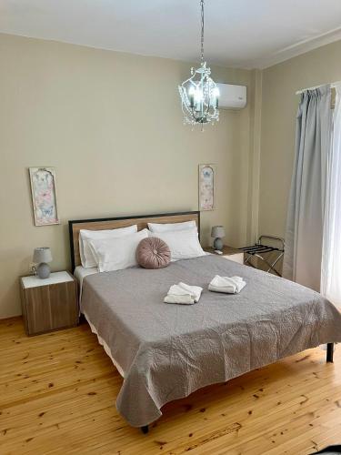 a bedroom with a bed with two towels on it at Salve Suite in Lefkada